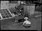 Thumbnail photo of six young children playing by House number 1 (Mandregan household at the time). Mary C. Bourdukofsky is second above center.