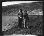 Thumbnail photo of two children near body of water.