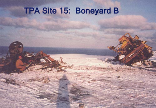Photo of large rusted metal objects in snow at "Boneyard B".