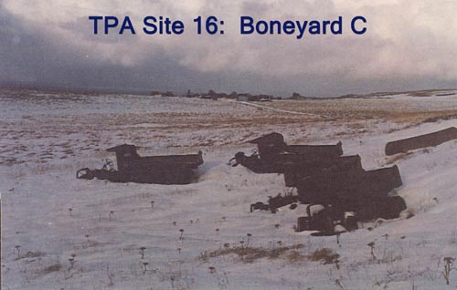 Photo of large rusted metal objects in the snow at "Boneyard C".