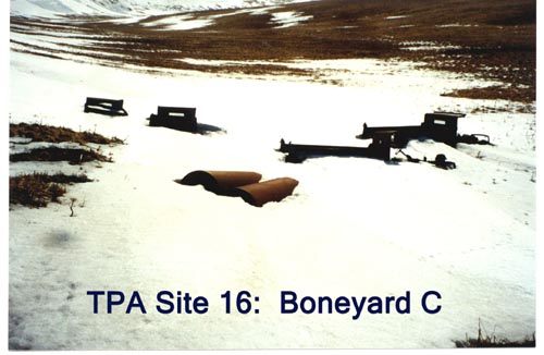 Photo of large rusted metal objects in the snow at "Boneyard C".