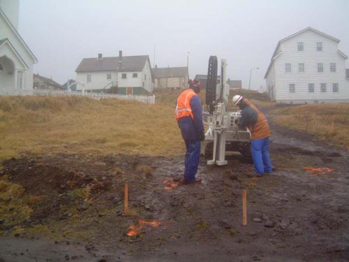 Photo of two people geoprobing at the Old Carpenter Shop.