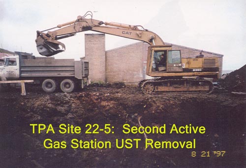 Photo of an excavator loading truck at the second Active Gas Sation UST Removal.