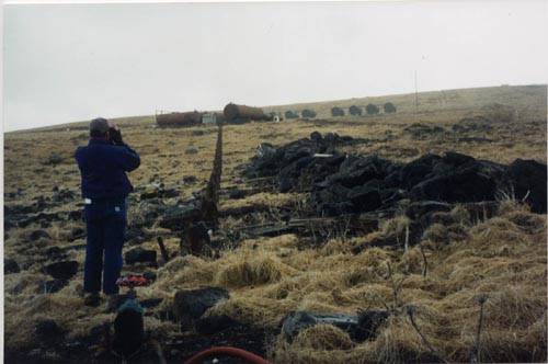 Photo of a person at the North-South Port Fuel Supply Line prior to remediation.