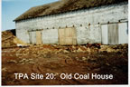Thumbnail photo of the Old Coal House, a heavily weathered white building.