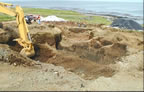 Thumbnail photo of heavy machinery excavating at the Inactive Gas Tank Farm.