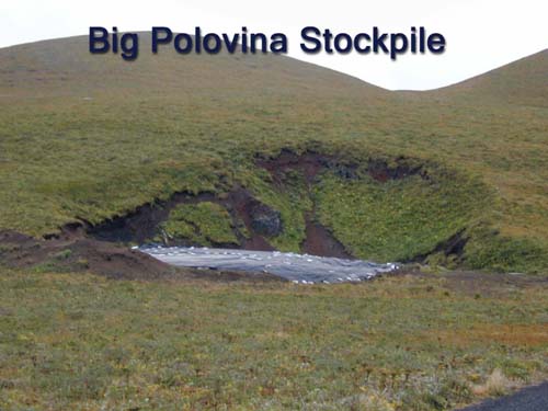 Photo of a tarp covered area of stockpile at Polovina Hill.
