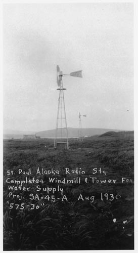 Photo of an historic photograph of a windmill well.