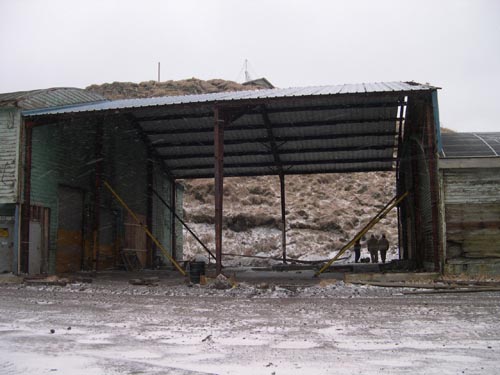 Photo of the Tract 46 Sheet Metal Garage during demolition work.