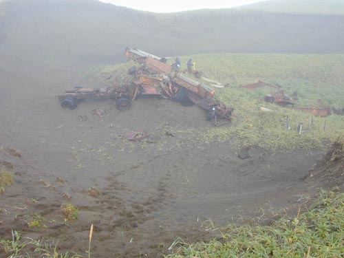 Photo of vehicle carcasses on hillside at the Dune Vehicle Boneyard.
