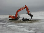 Thumbnail photo of an excavator removing the Bulldozer in the Bog.