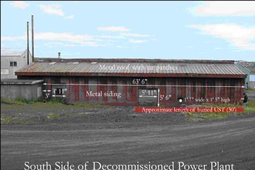 Photo of the south side of the decommisioned power plant, a low metal sided building.