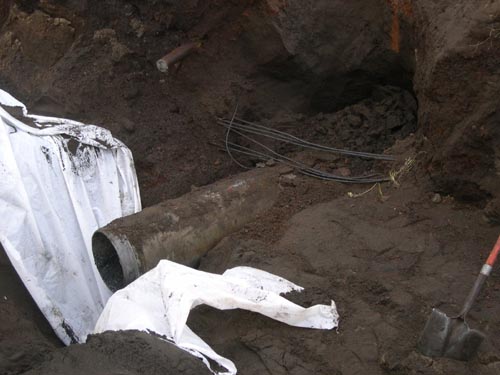 Photo of exposed underground pipe.