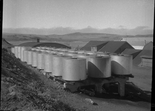 Photo of a group of large cylinders on a raised platform.