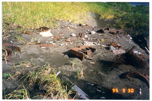 Photo of partially buried debris.
