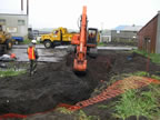 Thumbnail photo of an excavator digging a ditch.