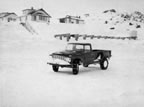 Thumbnail photo of old pickup truck on snowy landscape.
