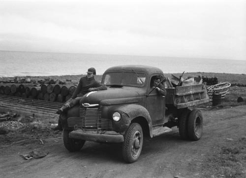 Photo of two men and a pickup truck at the St. George Oceanfront.