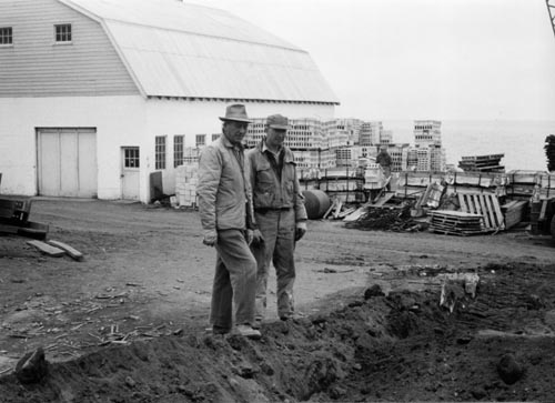 Photo of two men at the construction site.