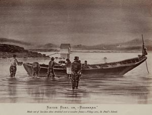 Photo of men standing in water near a boat of "baidara".